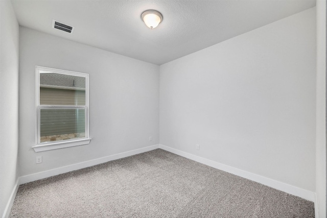 unfurnished room with light carpet