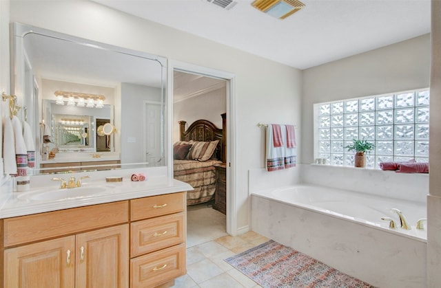 bathroom featuring a bath, vanity, and tile flooring