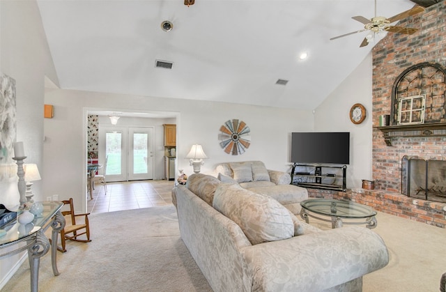 living room featuring light carpet, high vaulted ceiling, french doors, ceiling fan, and a fireplace