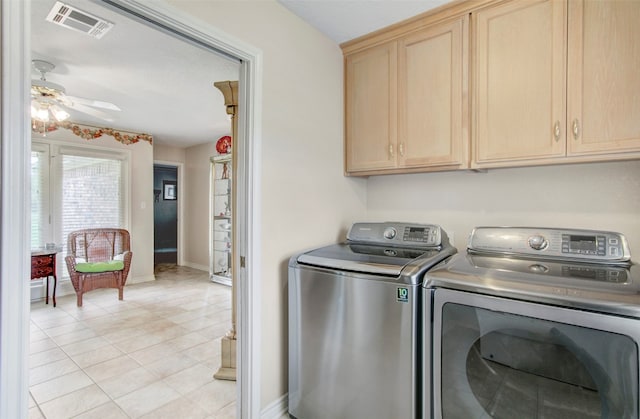 clothes washing area with light tile flooring, cabinets, independent washer and dryer, and ceiling fan