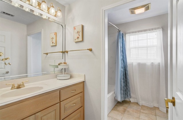 bathroom with shower / tub combo, vanity, and tile flooring