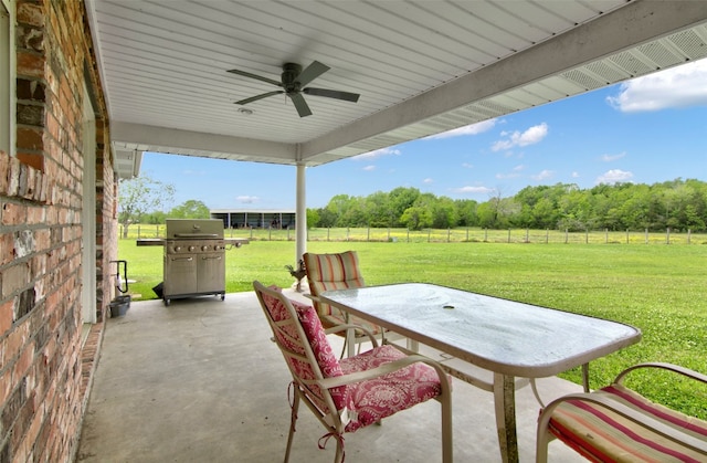 view of patio featuring ceiling fan and a grill