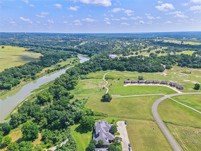 drone / aerial view with a water view and a rural view