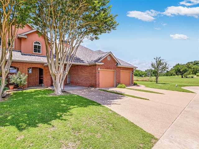 view of front of property with a garage and a front yard