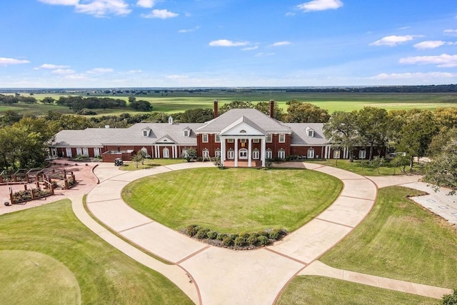 birds eye view of property with a rural view