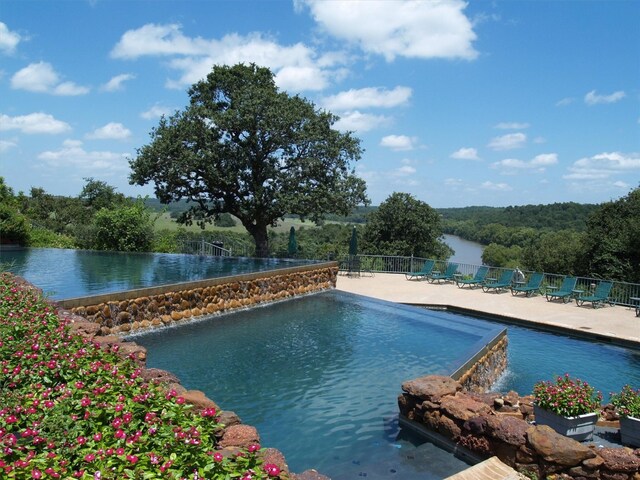 539 Colovista Pkwy Unit C101, Bastrop, TX 78602 - view of swimming pool with a patio area