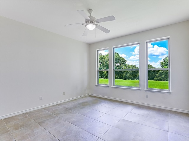 539 Colovista Pkwy Unit C101, Bastrop, TX 78602 - spare room featuring a ceiling fan, baseboards, and light tile patterned flooring