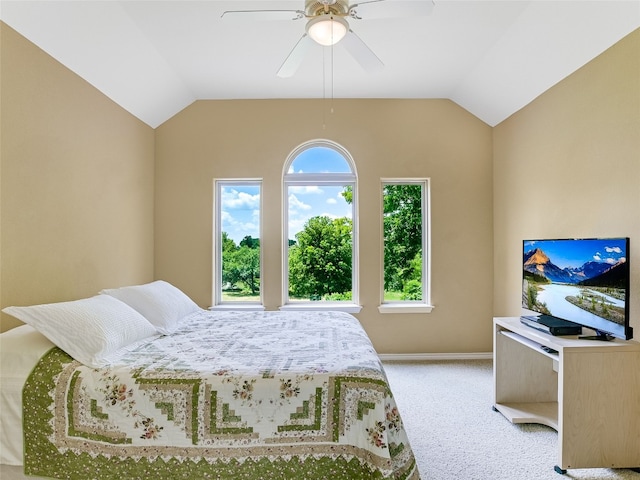 539 Colovista Pkwy Unit C101, Bastrop, TX 78602 - bedroom with light colored carpet, vaulted ceiling, baseboards, and a ceiling fan