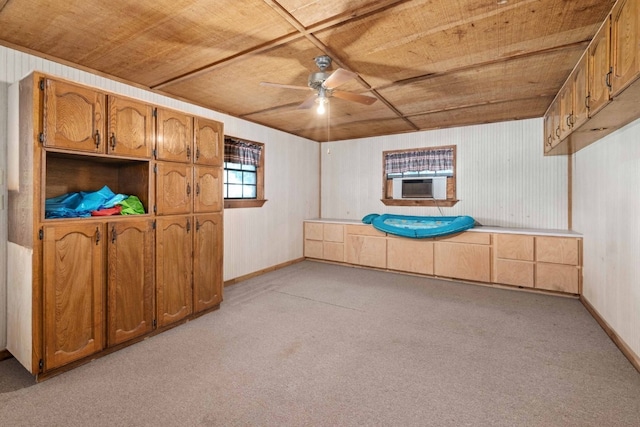 interior space featuring wooden ceiling and light colored carpet