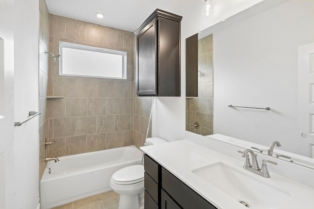 full bathroom with tile patterned flooring, vanity, toilet, and tiled shower / bath combo