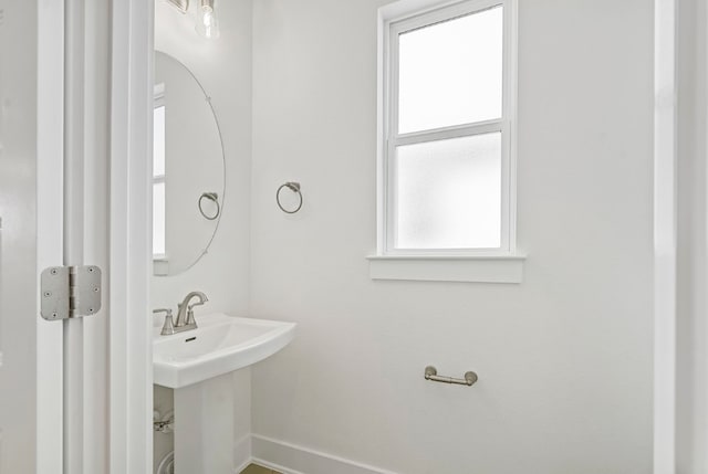 bathroom with a wealth of natural light and sink