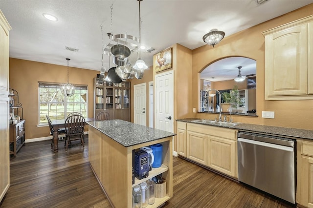 kitchen with dishwasher, a center island, dark wood-type flooring, sink, and ceiling fan with notable chandelier