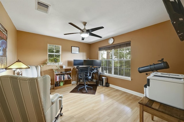 office area with ceiling fan and light wood-type flooring