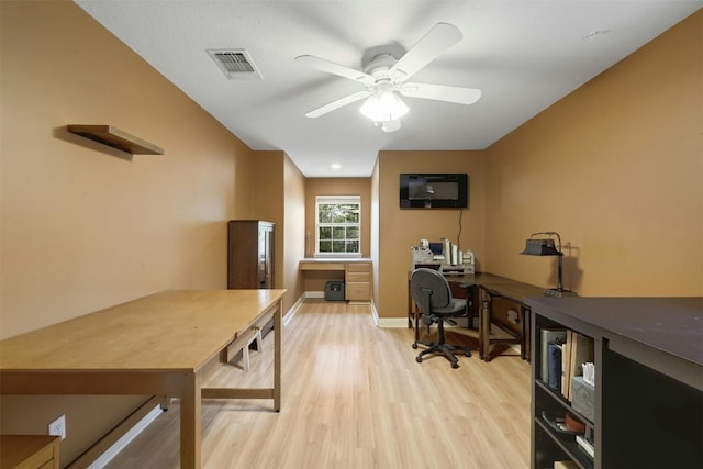 office featuring light hardwood / wood-style floors and ceiling fan