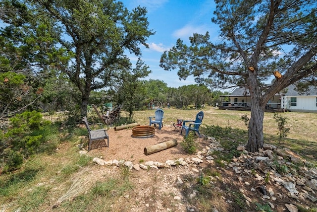 view of yard with a fire pit