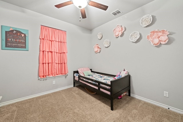 bedroom with light colored carpet and ceiling fan