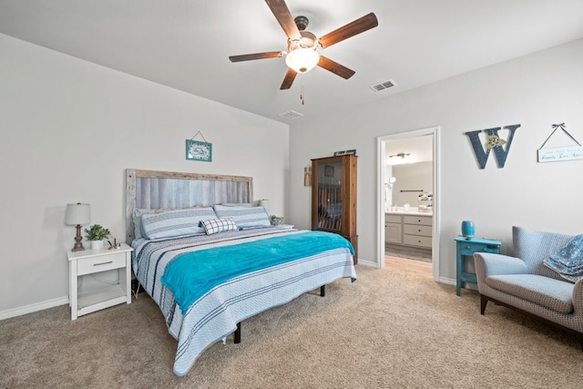 carpeted bedroom with ceiling fan and connected bathroom