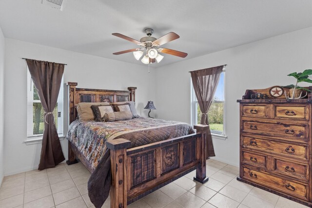 bedroom featuring ceiling fan and light tile patterned flooring