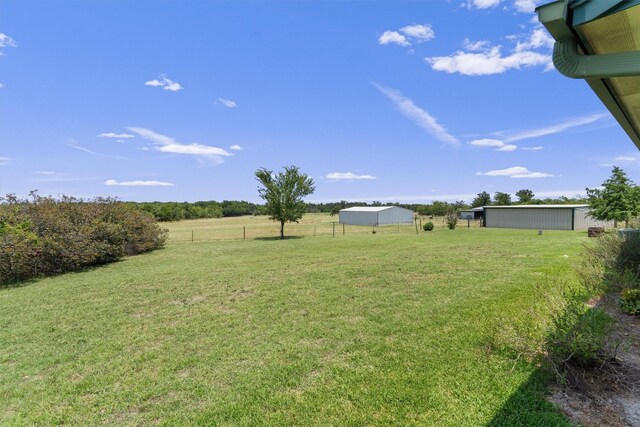 view of yard with a rural view