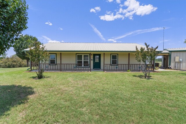 ranch-style house with a front lawn and a porch