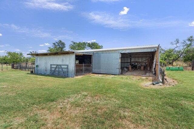 view of outdoor structure with a yard