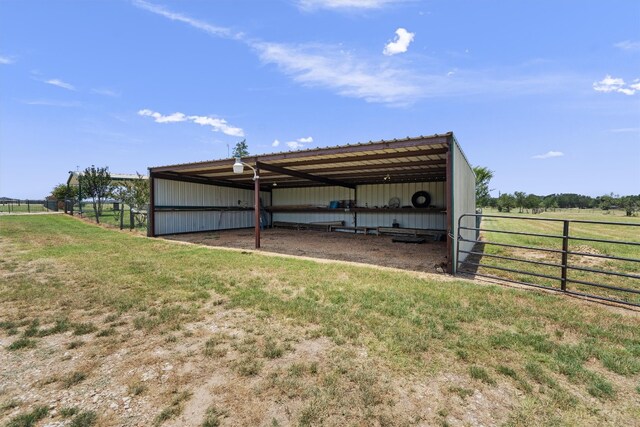 view of outdoor structure with a rural view