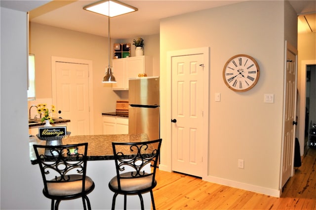 dining room featuring light hardwood / wood-style flooring