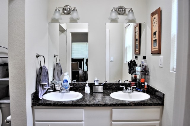 bathroom with dual vanity