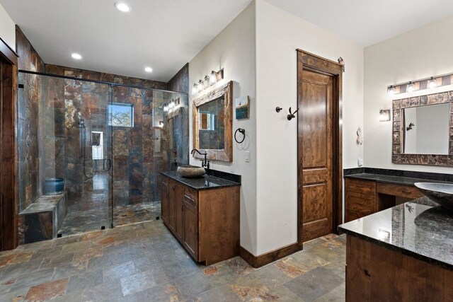 bathroom featuring walk in shower, tile floors, and dual bowl vanity