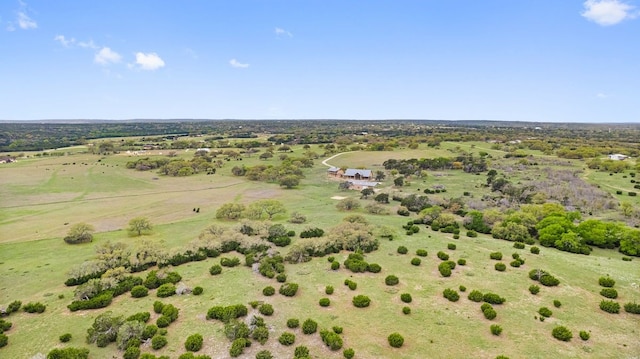 birds eye view of property with a rural view