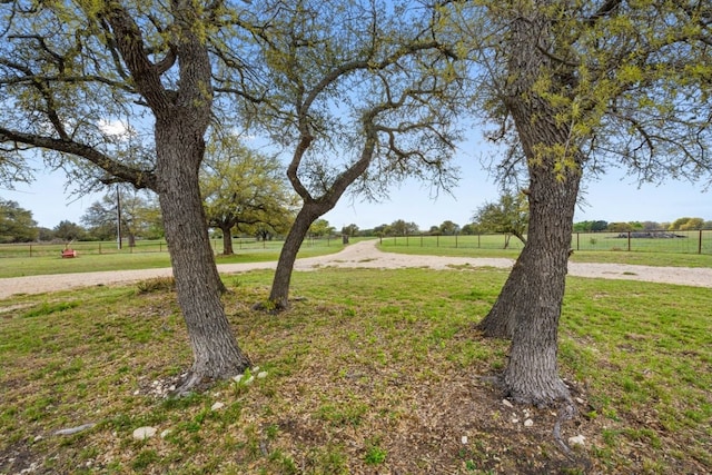 view of yard with a rural view