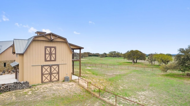 view of shed / structure with a rural view and central AC unit