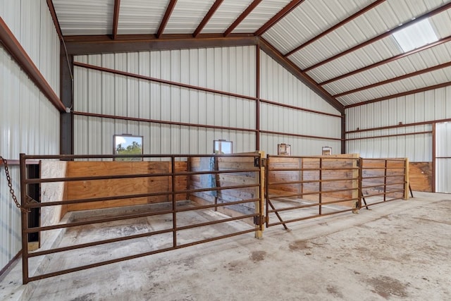 view of horse barn with an outdoor structure