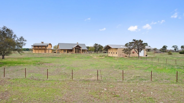 view of yard with a rural view