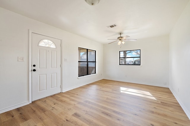 entryway with light hardwood / wood-style floors and ceiling fan