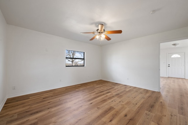 empty room featuring light hardwood / wood-style floors and ceiling fan