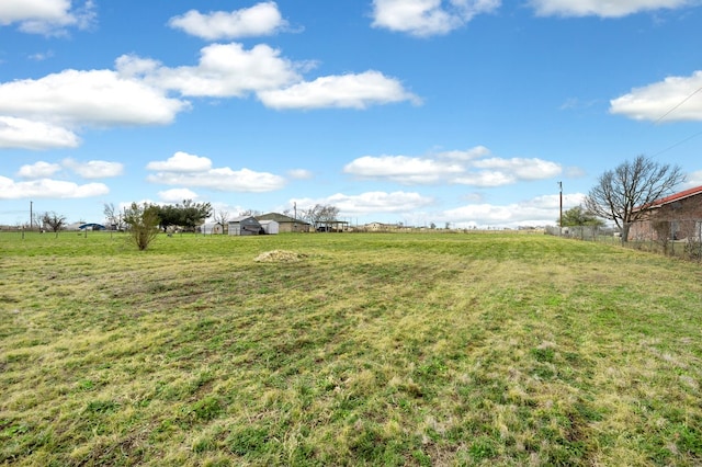 view of yard with a rural view