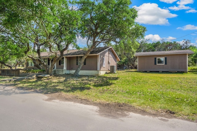 ranch-style home featuring a front yard