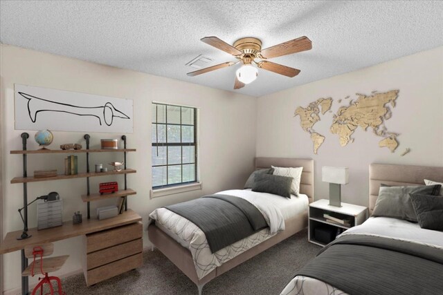 carpeted bedroom with a textured ceiling and ceiling fan