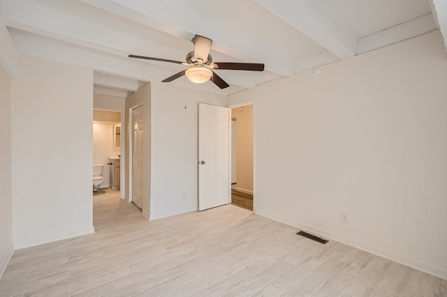 unfurnished room with ceiling fan, beam ceiling, and light hardwood / wood-style floors