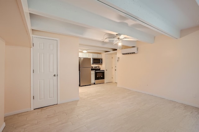 interior space with ceiling fan, stainless steel refrigerator, light wood-type flooring, and a wall mounted air conditioner