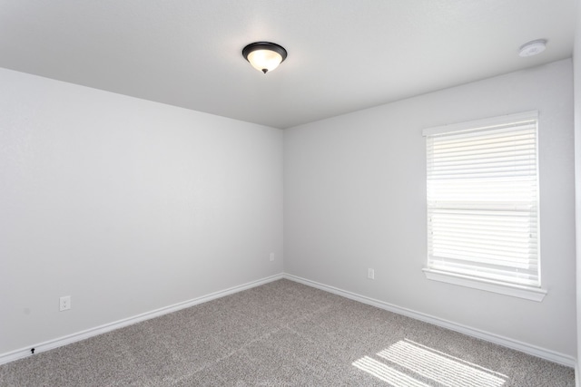 empty room featuring light colored carpet