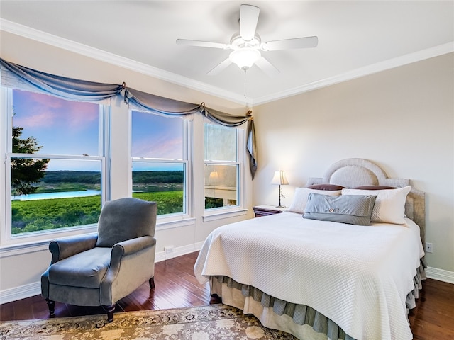 bedroom featuring dark wood-style floors, baseboards, a ceiling fan, and crown molding