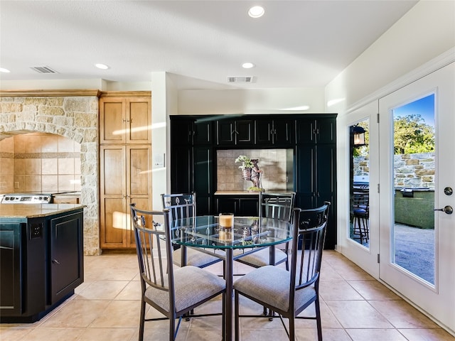 dining room with recessed lighting, visible vents, and light tile patterned flooring