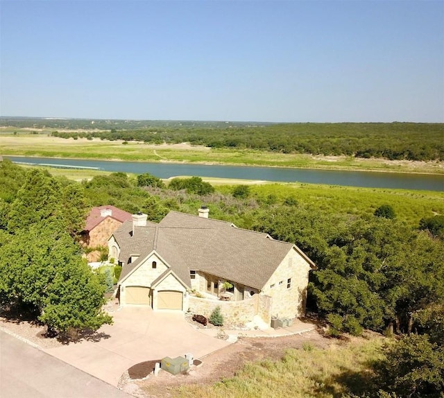 drone / aerial view with a water view