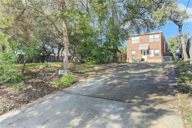 view of road with concrete driveway