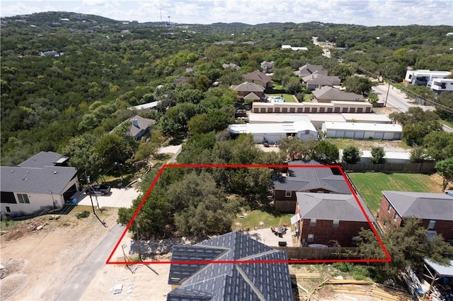 aerial view with a residential view and a wooded view