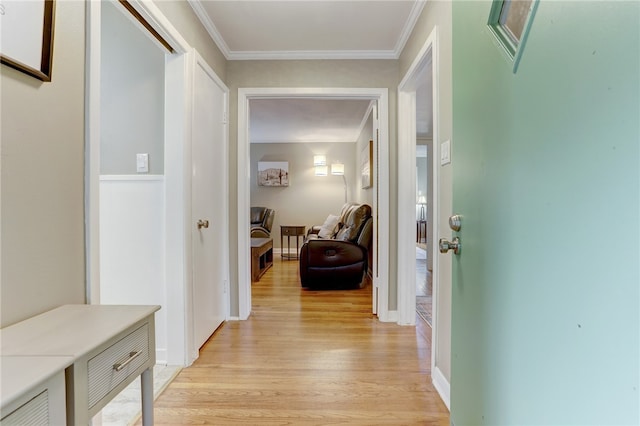 hall featuring light hardwood / wood-style floors and crown molding