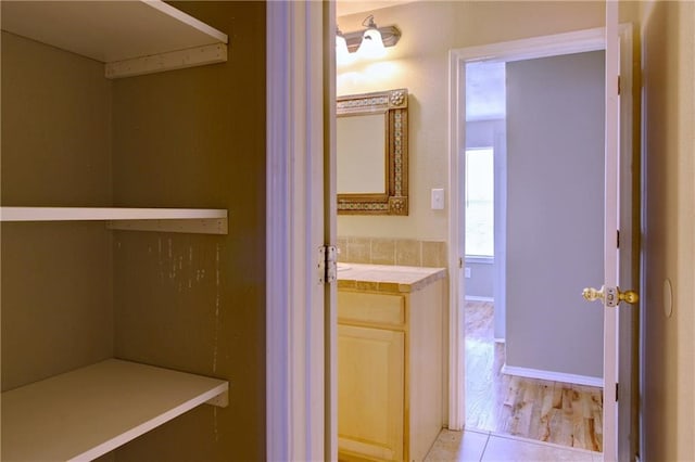 bathroom with vanity and hardwood / wood-style flooring