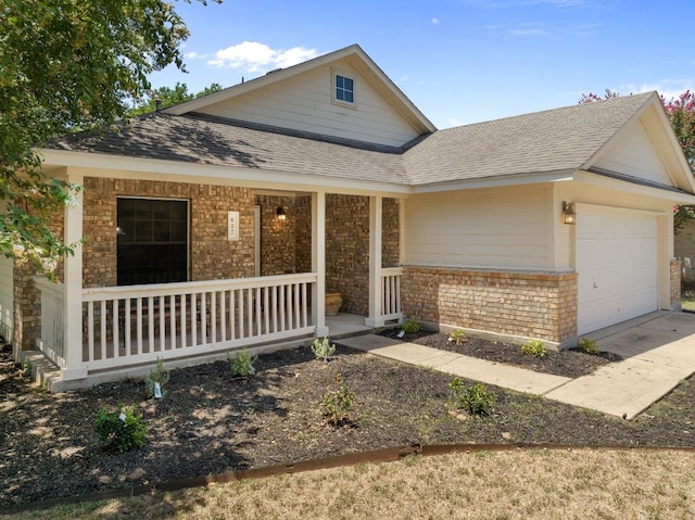 view of front of property with a garage and covered porch